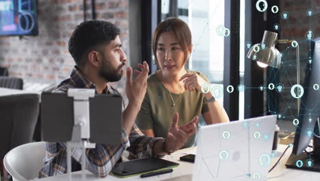 animation of digital icons with connections over diverse business people in office