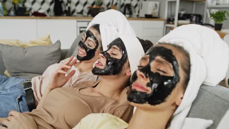 video of women in a face mask relaxing at home