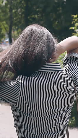 woman in striped shirt outdoors