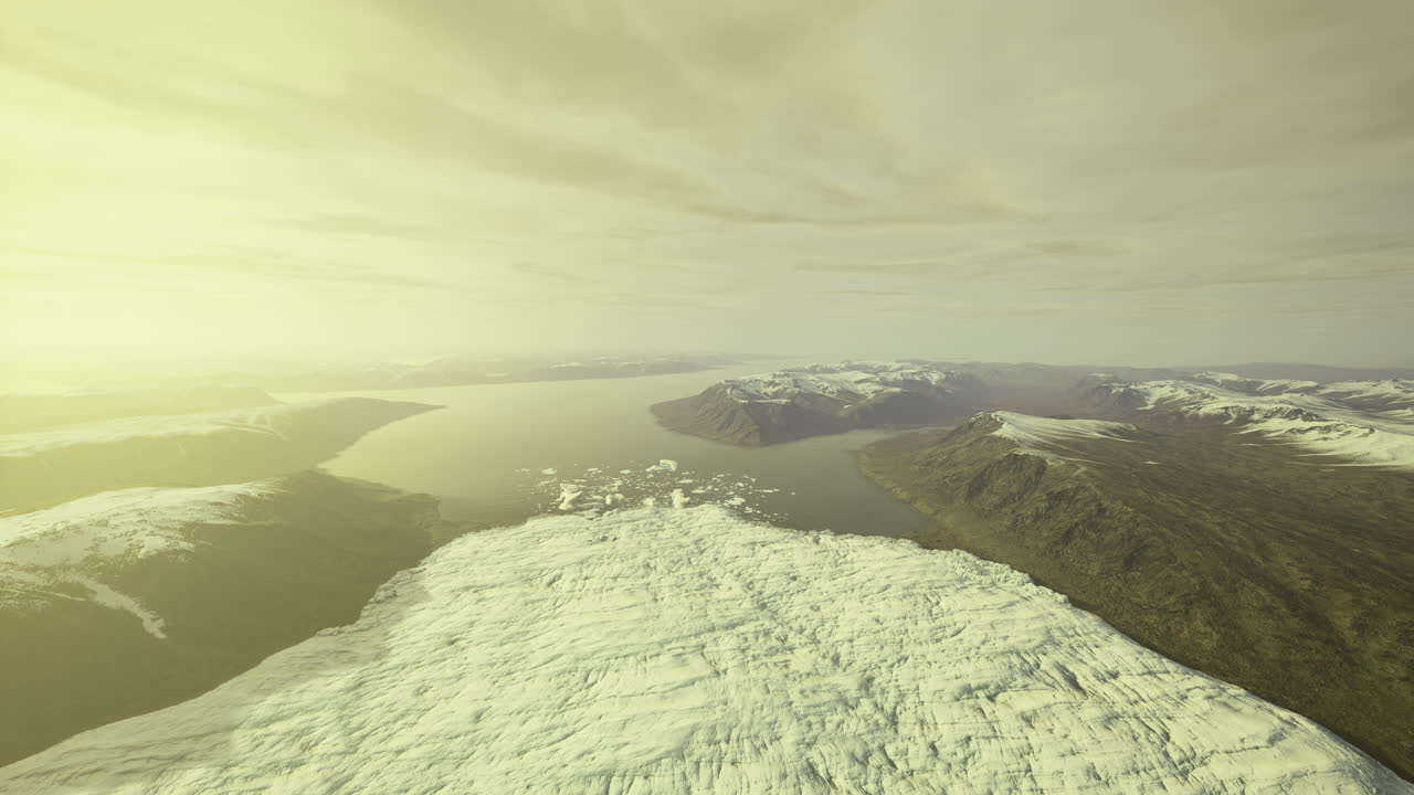 Majestic aerial view of snow capped mountains and serene water landscape