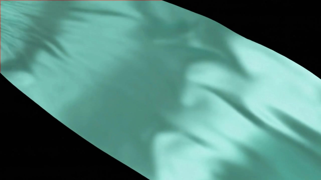 Tessuto di seta verde menta fluido su sfondo nero