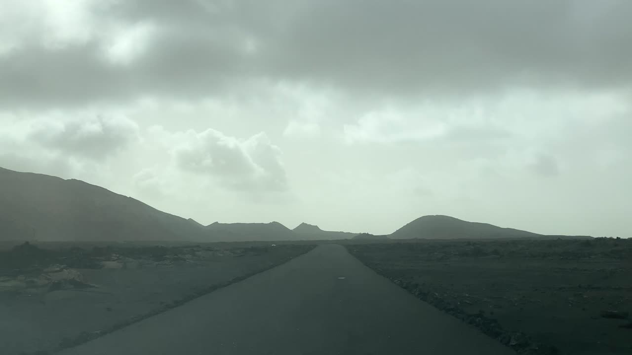 Driving through Timanfaya National Park. Point of view dash cam footage