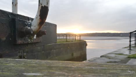 Sunrise-waterfront-British-canal-gates-leading-to-river-Mersey