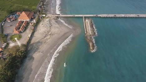 tanah ampo pier reveal blue water beach from above