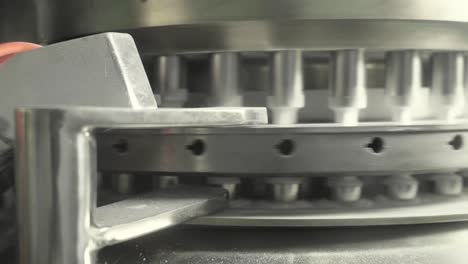 A machine sorting pills in a circular motion
