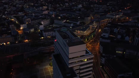 aerial night cityscape of kaiserslautern : municipality building and shopping mall in west germany known for the u