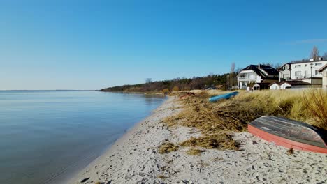 kuznica tourist spot in hel peninsula, poland, slow aerial straight forwardement towards the horizon over the baltic sea