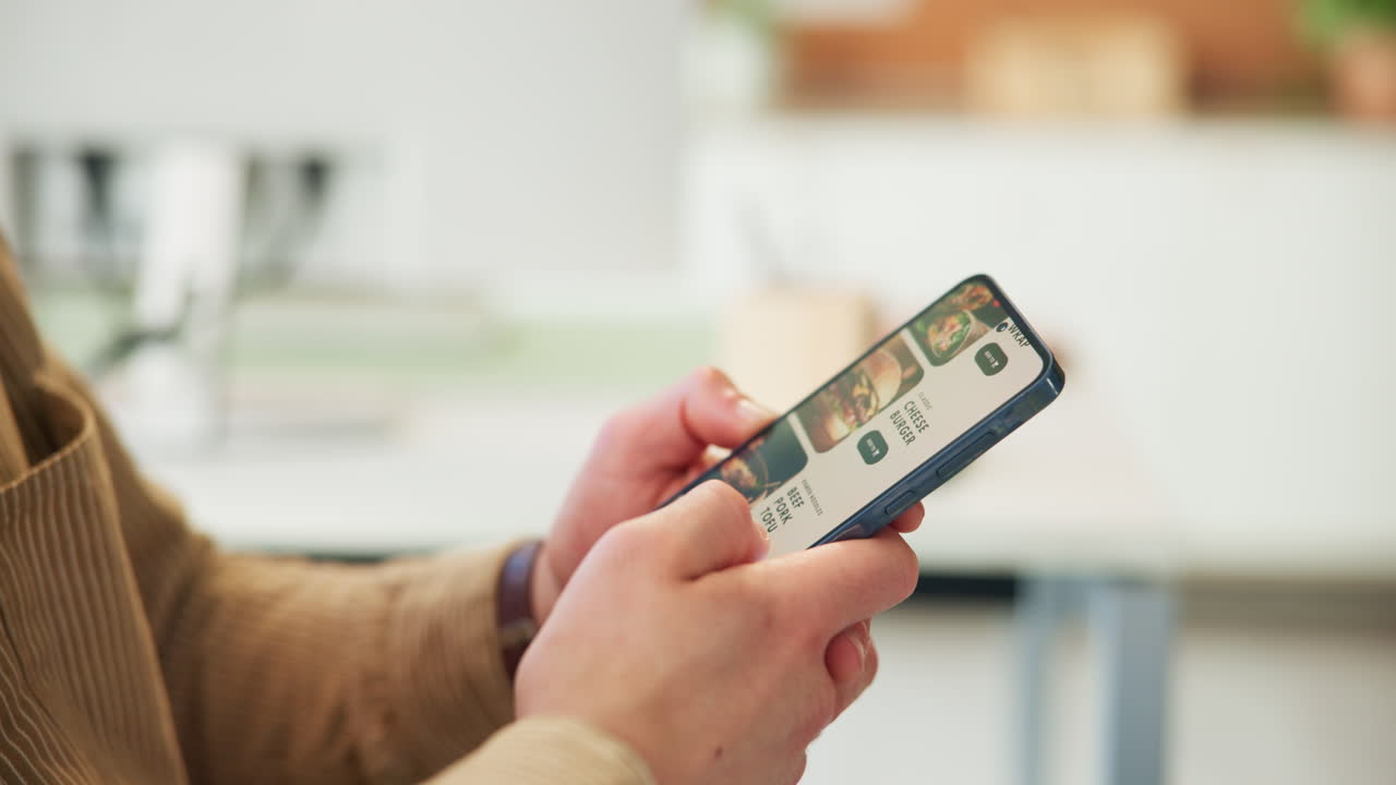 Close-up of Hands Scrolling Food Delivery App on Smartphone