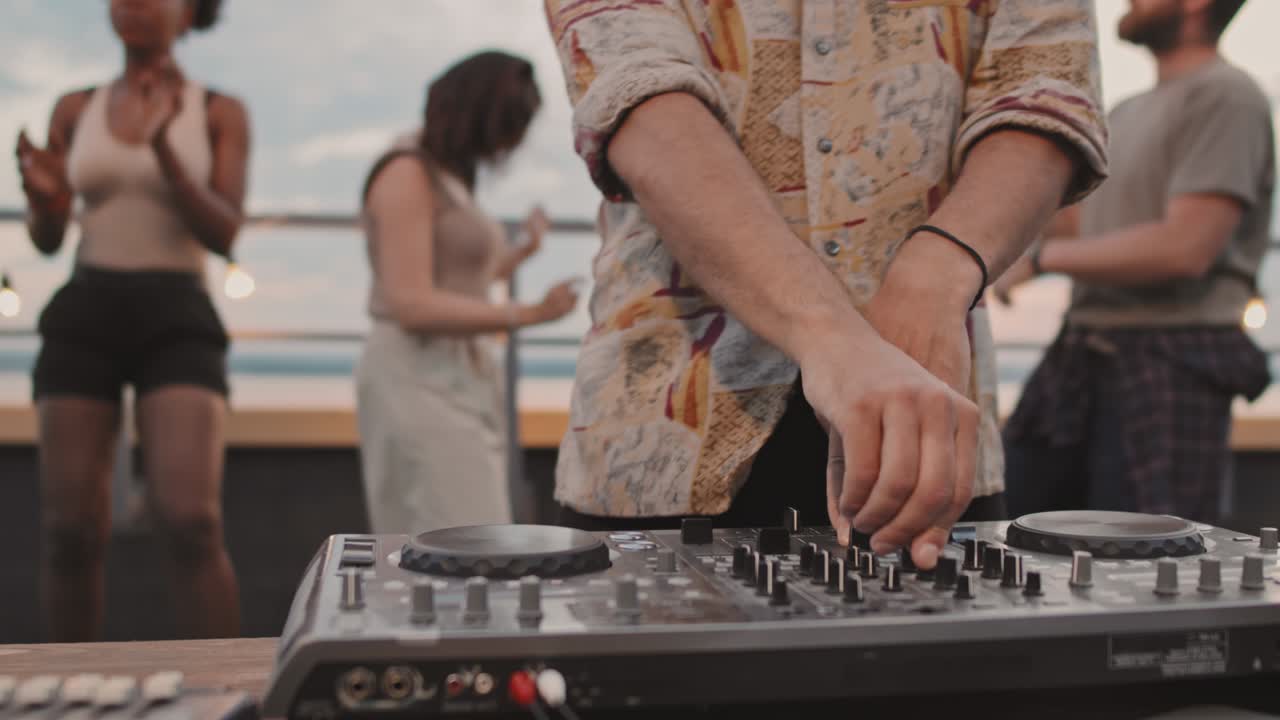 Close Up of DJ Playing at Party