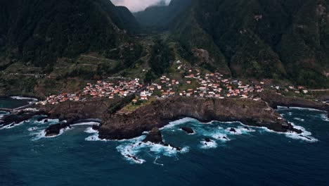 immerse yourself in the golden hues of sunset over madeira’s seixal coast with this mesmerizing drone footage.