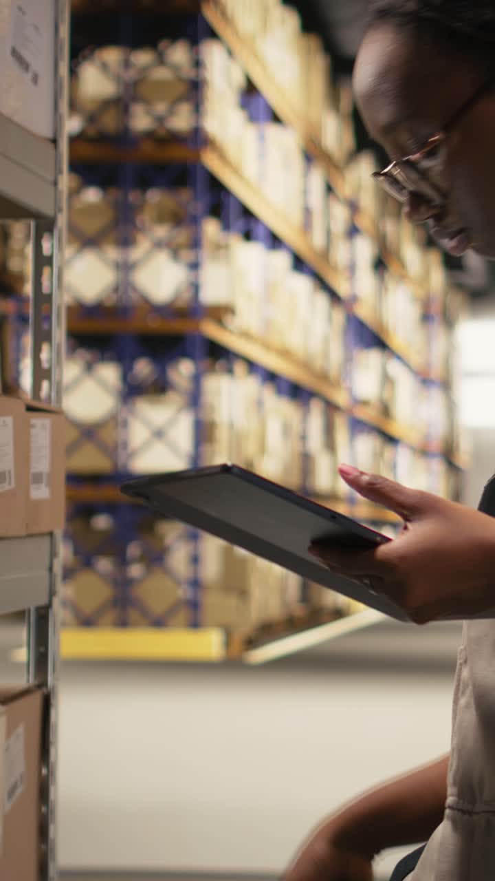 Vertical Video African american e-commerce worker scanning shipping labels numbers