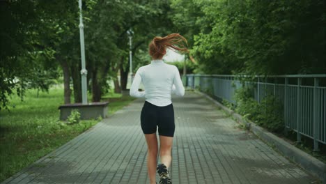 a woman jogging in the park