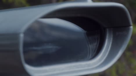 coin operated binoculars in autumn with mountains in reflection extreme close up