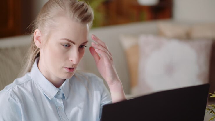 Beautiful Thoughtful Concerned Woman Working On Laptop 2