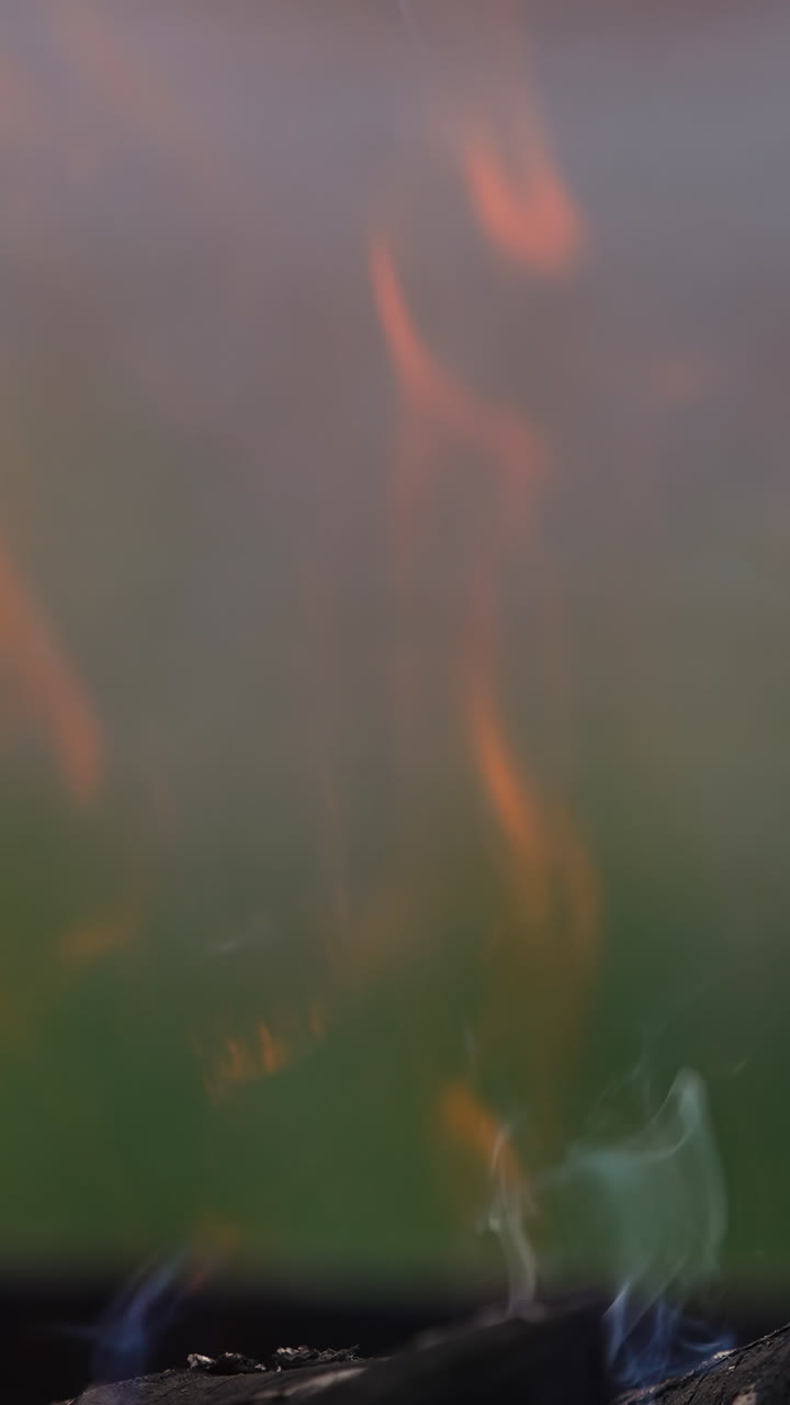 Background of burning hot coals. Close up view of bonfire burning outdoors