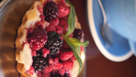 delicious raspberry and blackberry tart with mint