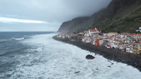 Fantastic-panoramic-aerial-shot-over-the-coast-of-the-city-of-Paul-do-Mar,-where-you-can-see-the-beautiful-houses