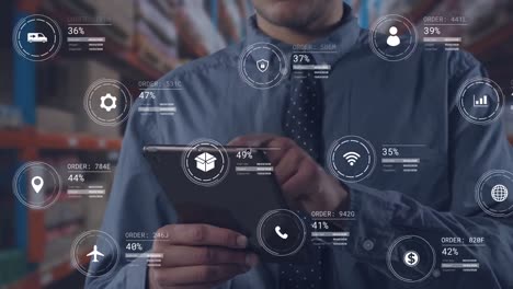 Animation of icons with data processing over caucasian worker using tablet in warehouse