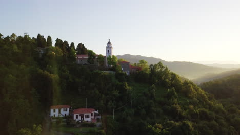 Aerial-of-beautiful-Italian-countryside-villages-and-trees-in-Europe-during-morning-golden-hour-light