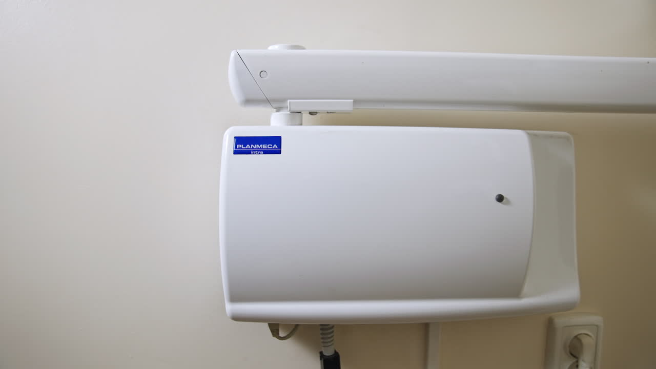 Wall x-ray dental apparatus in the medical cabinet. Equipment in dentist's office.