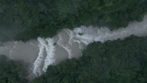 Famous-Semuc-champey-waterfall-during-rain-season,-aerial