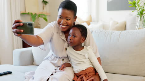 Smartphone,-selfie-and-mother-with-child-on-living
