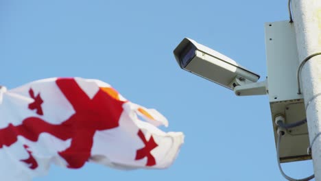 video camera is hanging on a pole, georgian flag