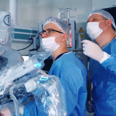 innovative robotic equipment in surgery. two surgeons discuss the operating process by medical robot. modern surgical robot during work.