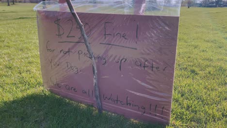 sign reminding dog owners to pick up after their dogs