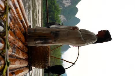 hanfu girl in traditional clothing on bamboo raft shakes draping sleeves