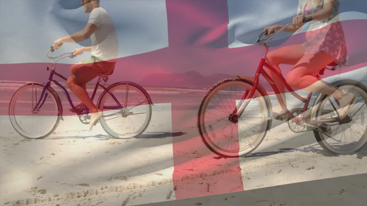 Riding bicycles on beach with Danish flag animation overlaying scene