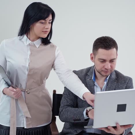 . couple browsing on laptop. portrait of business couple looking at laptop computer