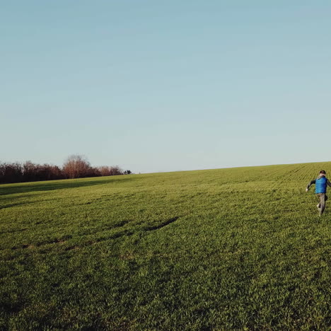 two boys playing on the field. aerial view square video