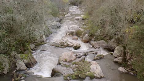 low aerial view of water rapids in slow motion