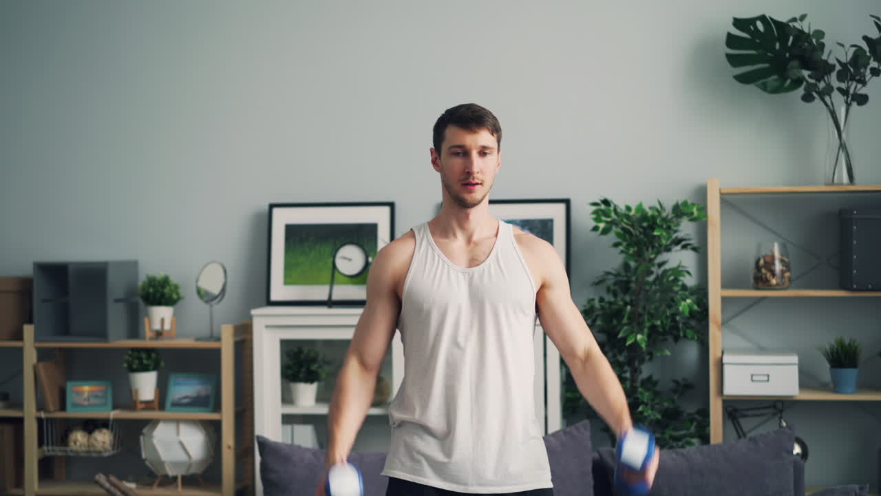 Man Performing Dumbbell Arm Workout at Home