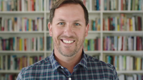 portrait young man student smiling bookshelf library university