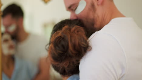 Happy-couple,-face-mask-and-skin-care-in-home