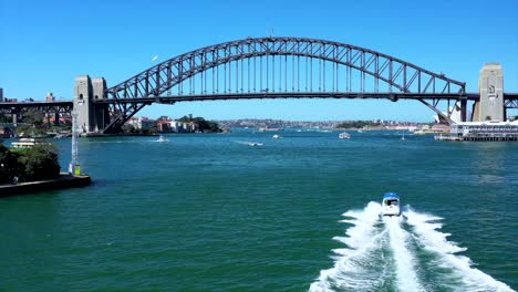 Drone-over-Sydney-Harbour-tracks-along-Sydney-Harbour-Bridge-on-beautiful-sunny-day