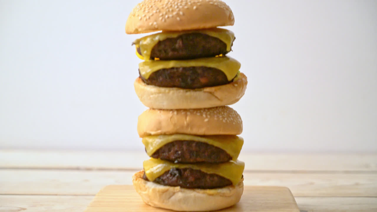 Premium stock video Hamburger or beef burgers with cheese unhealthy