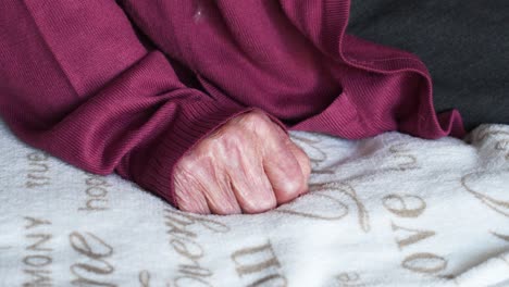 hand giving documents through a glass divider at a counter