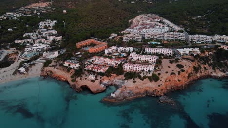 aerial view of cala tarida beach coastline resort hotels