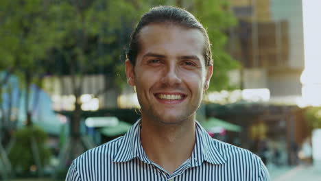 a smiling man outdoors
