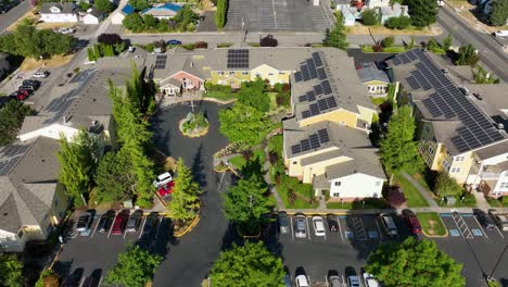 Drone-shot-of-solar-panels-on-top-of-apartment-units-in-Anacortes,-WA