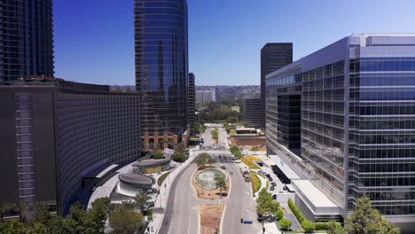 Low-descending-aerial-shot-over-Avenue-of-the-Stars-in-Century-City,-California