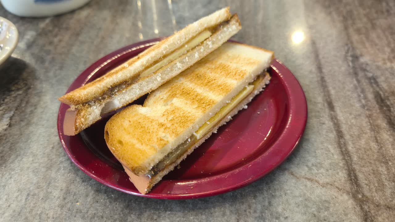 Classic Malaysian toasted bread sliced and filled with golden brown kaya and thin butter. The rich spreads are sandwiched between two crispy pieces. This iconic snack is traditionally served with hot