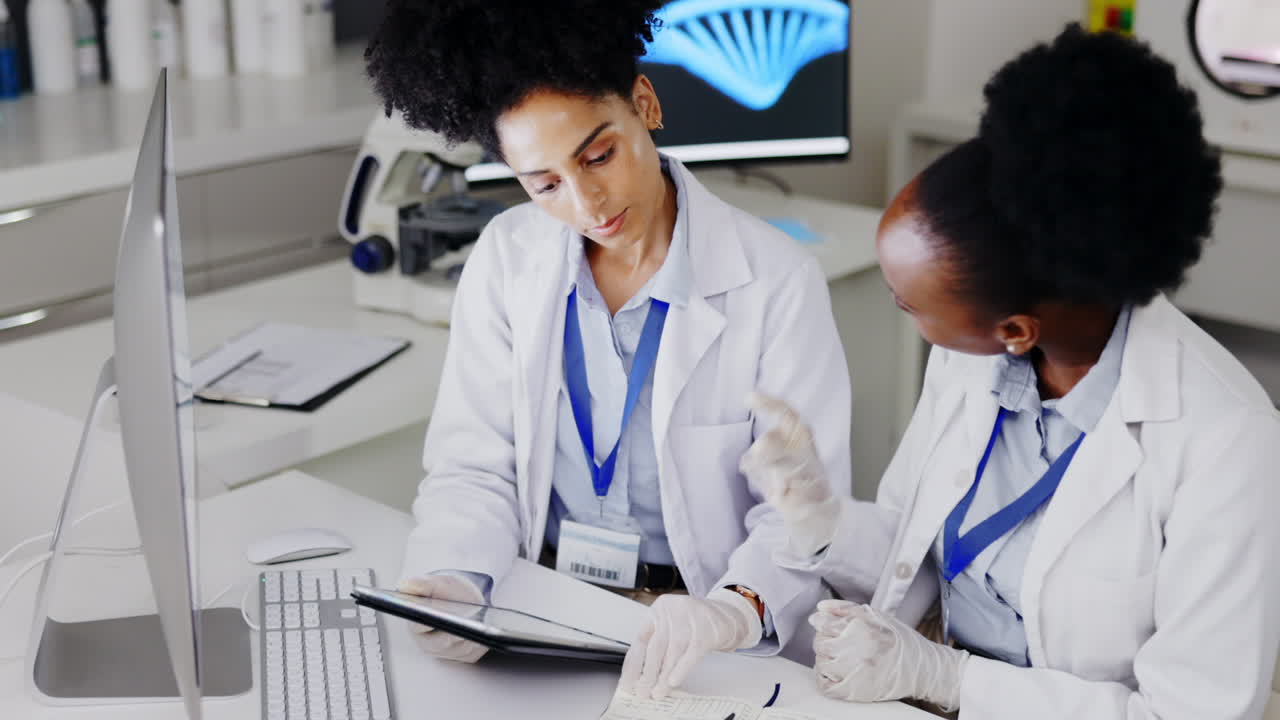 Tablet, planning and women in a lab for science