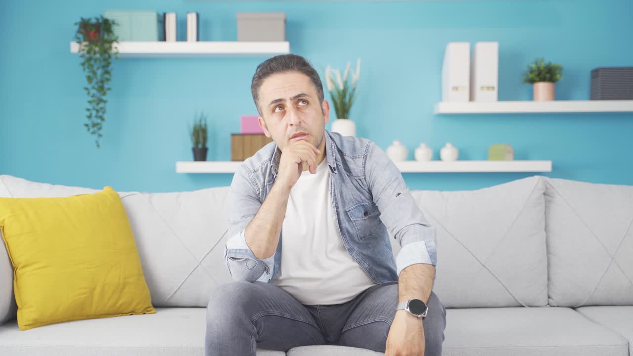 Confused man thinks and can't figure it out.