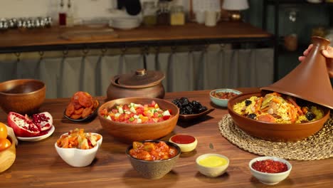 moroccan cuisine. tajine, traditional dish made of lamb and eggplant, vegetable salad. middle eastern culture. couscous with mutton close-up, delicious rice. homemade food.