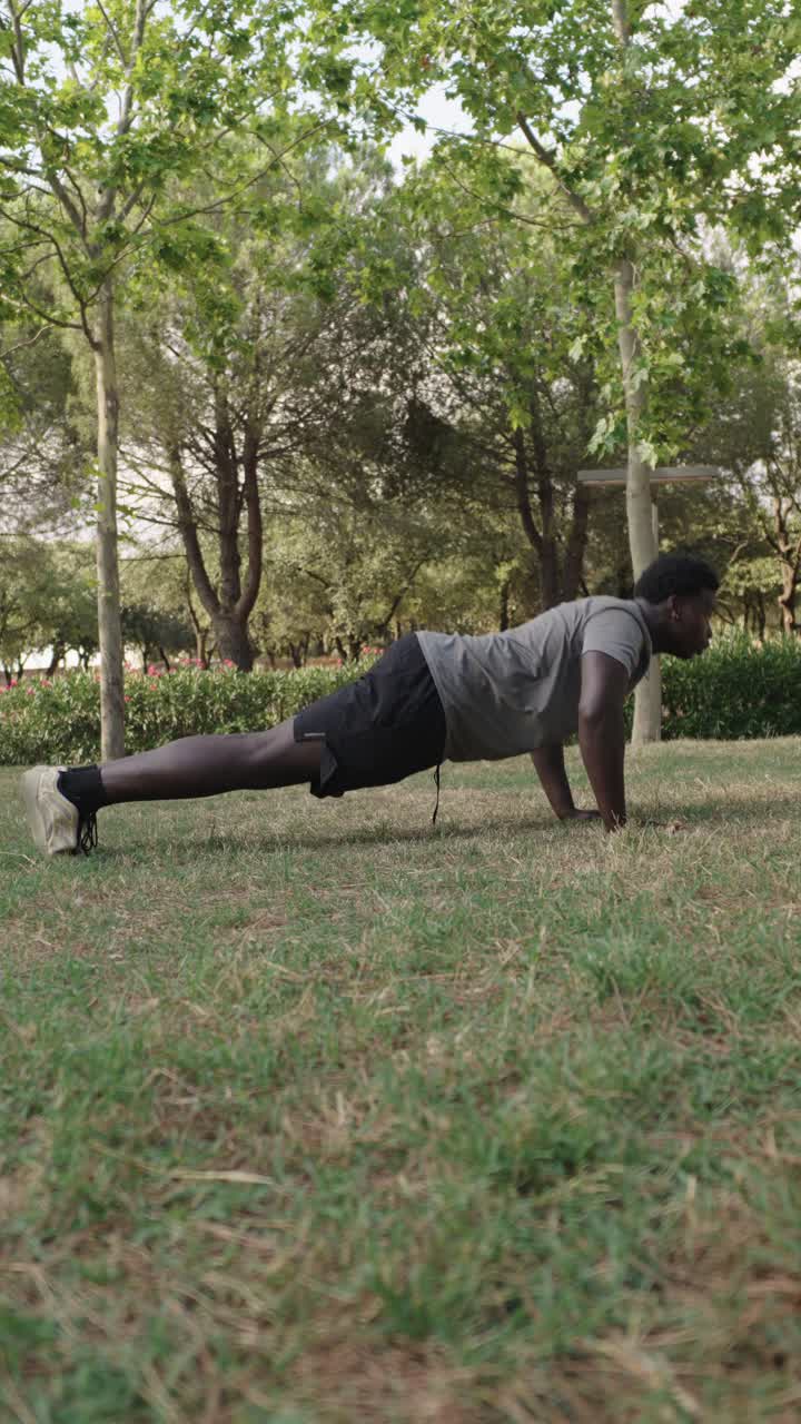 Man doing push-ups in a park