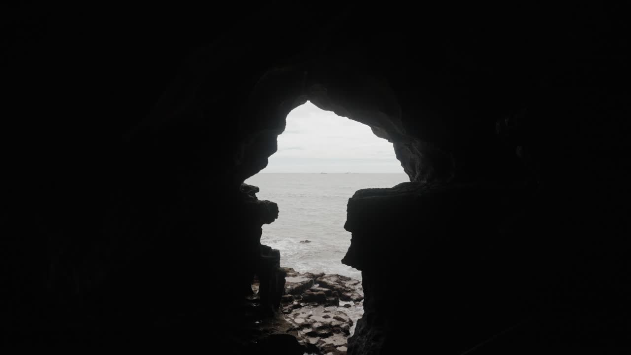 View from inside the Hercules Cave in Tangier, Morocco, with its iconic Africa-shaped opening facing the Atlantic Ocean